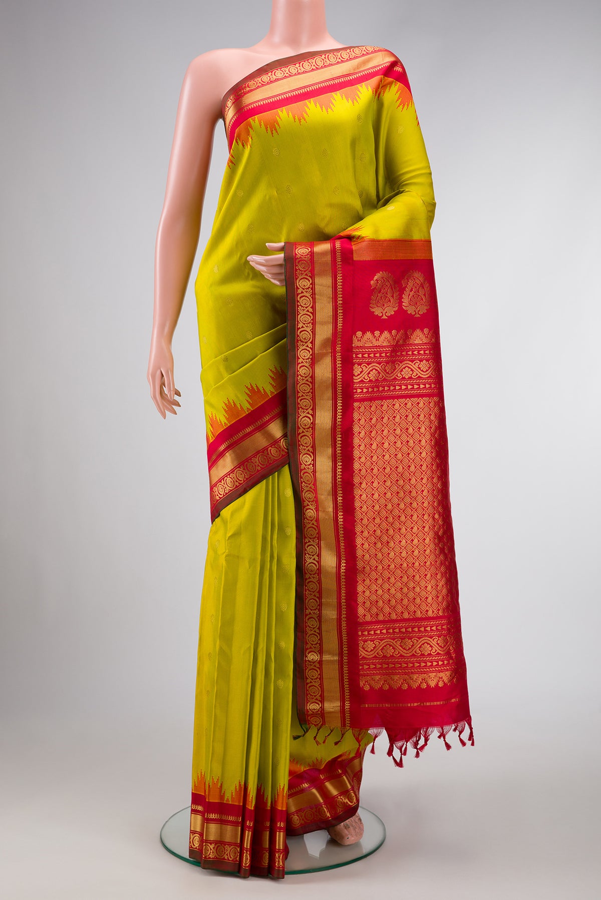 Mehandi Green Dual Tone Gadwal Silk Saree with Zari Butta on the body and Zari Border.  displayed on a mannequin