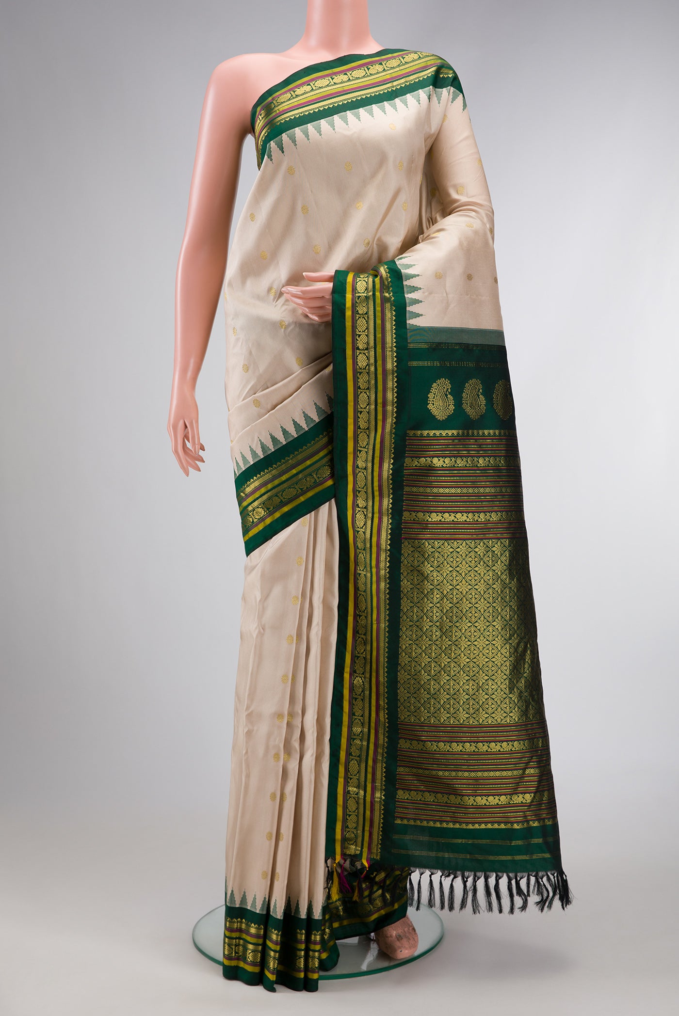 Beige Dual Tone Gadwal Silk Saree with Zari Butta on the body and Temple Border.  displayed on a mannequin