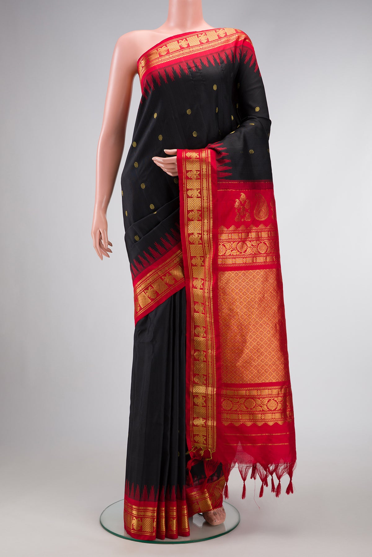 Black Dual Tone Gadwal Silk Saree with Zari Butta on the body and Zari Border.  displayed on a mannequin
