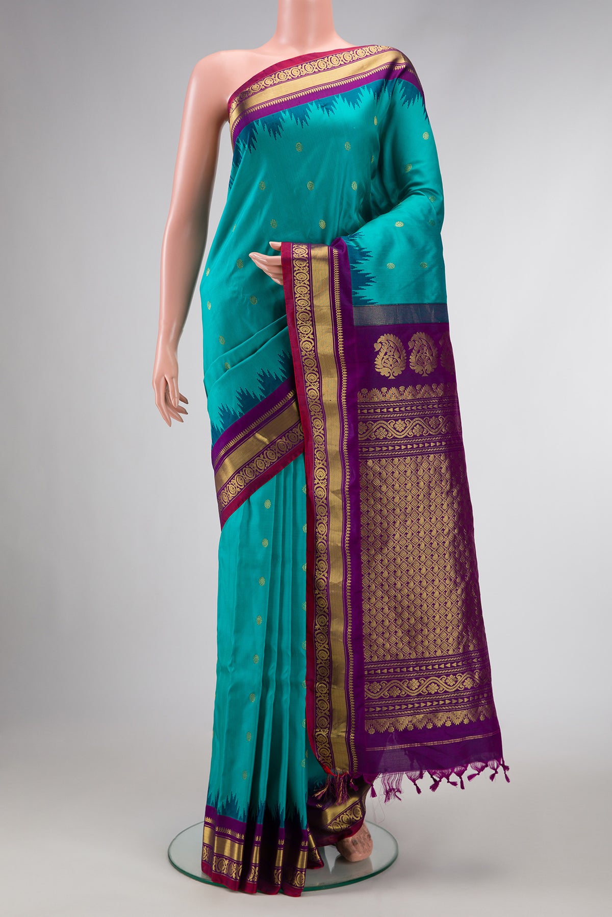 Maya Blue Dual Tone Gadwal Silk Saree with Zari Butta on the body and Zari Border.  displayed on a mannequin