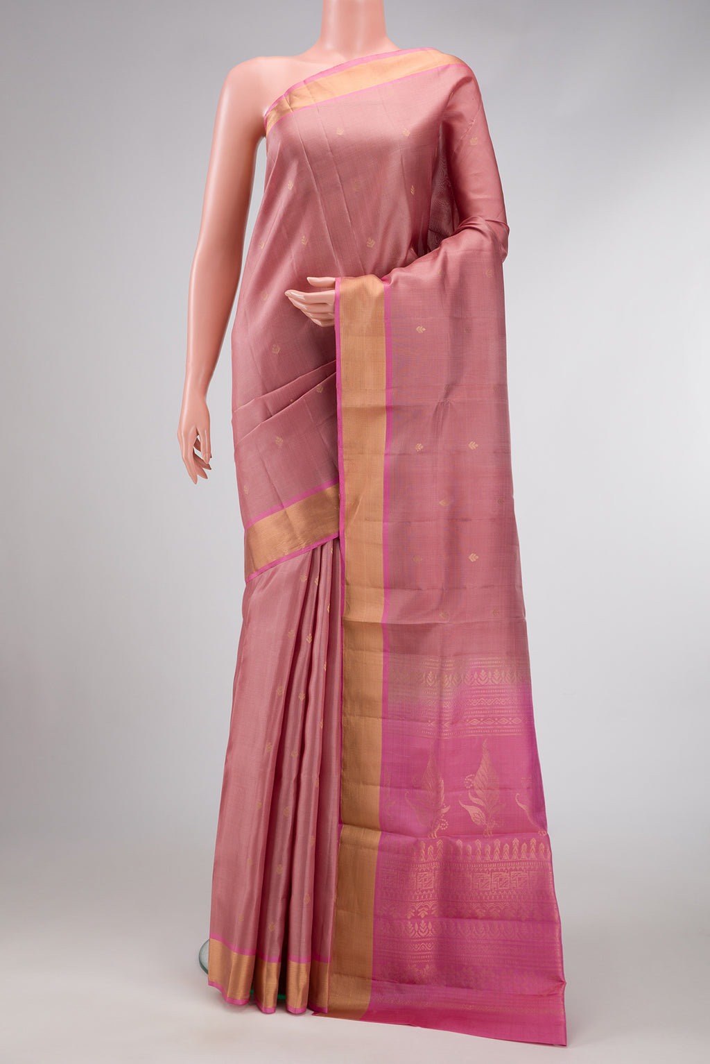 Rose Gold Dual Tone Soft Silk Saree with Zari Butta on the body and Zari Border.  displayed on a mannequin