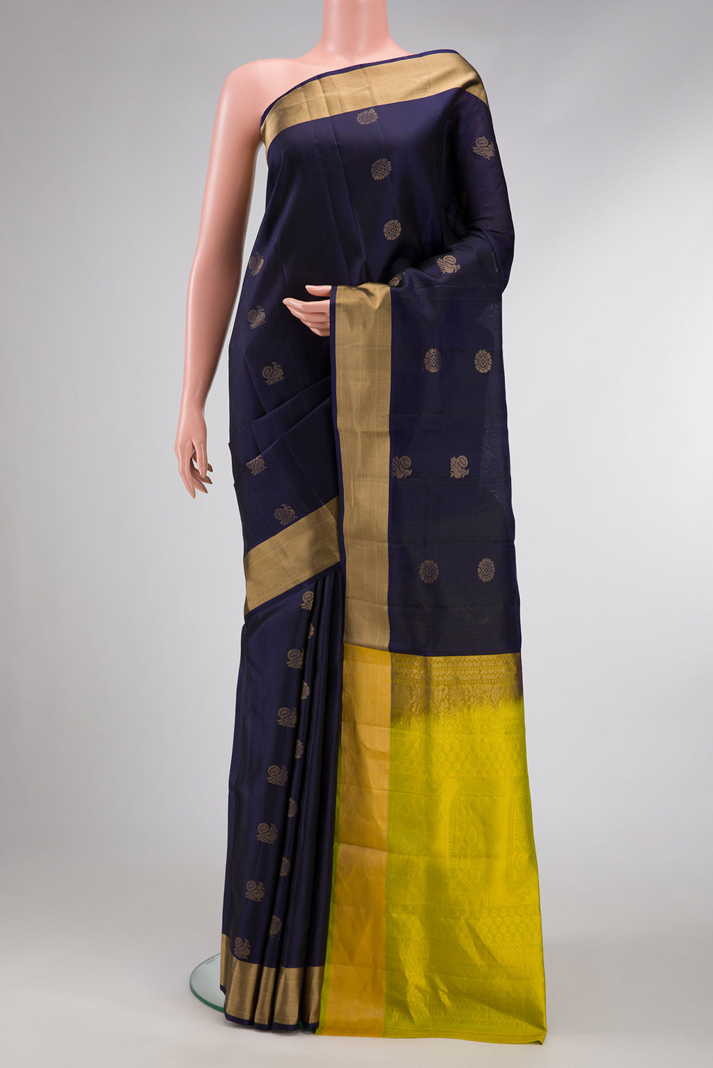Navy Blue Dual Tone Soft Silk Saree with Zari Butta on the body and Zari Border.  displayed on a mannequin