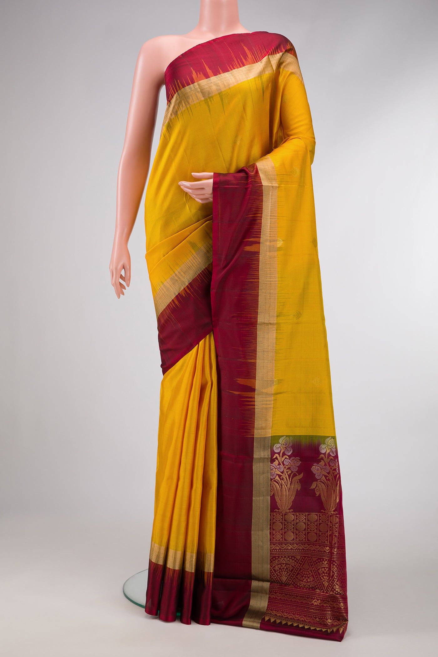 Yellow Dual Tone Soft Silk Saree with Zari Butta on the body and Zari Border.  displayed on a mannequin
