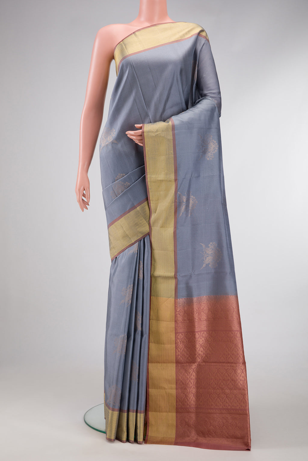 Grey Dual Tone Soft Silk Saree with Zari Butta on the body and Zari Border.  displayed on a mannequin