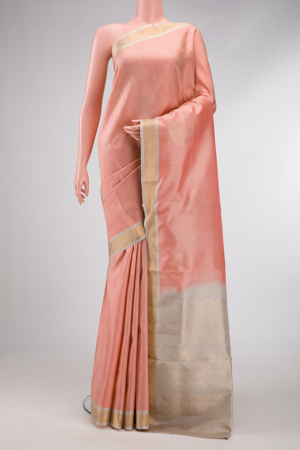 Rose Gold Dual Tone Soft Silk Saree with Zari Butta on the body and Zari Border.  displayed on a mannequin