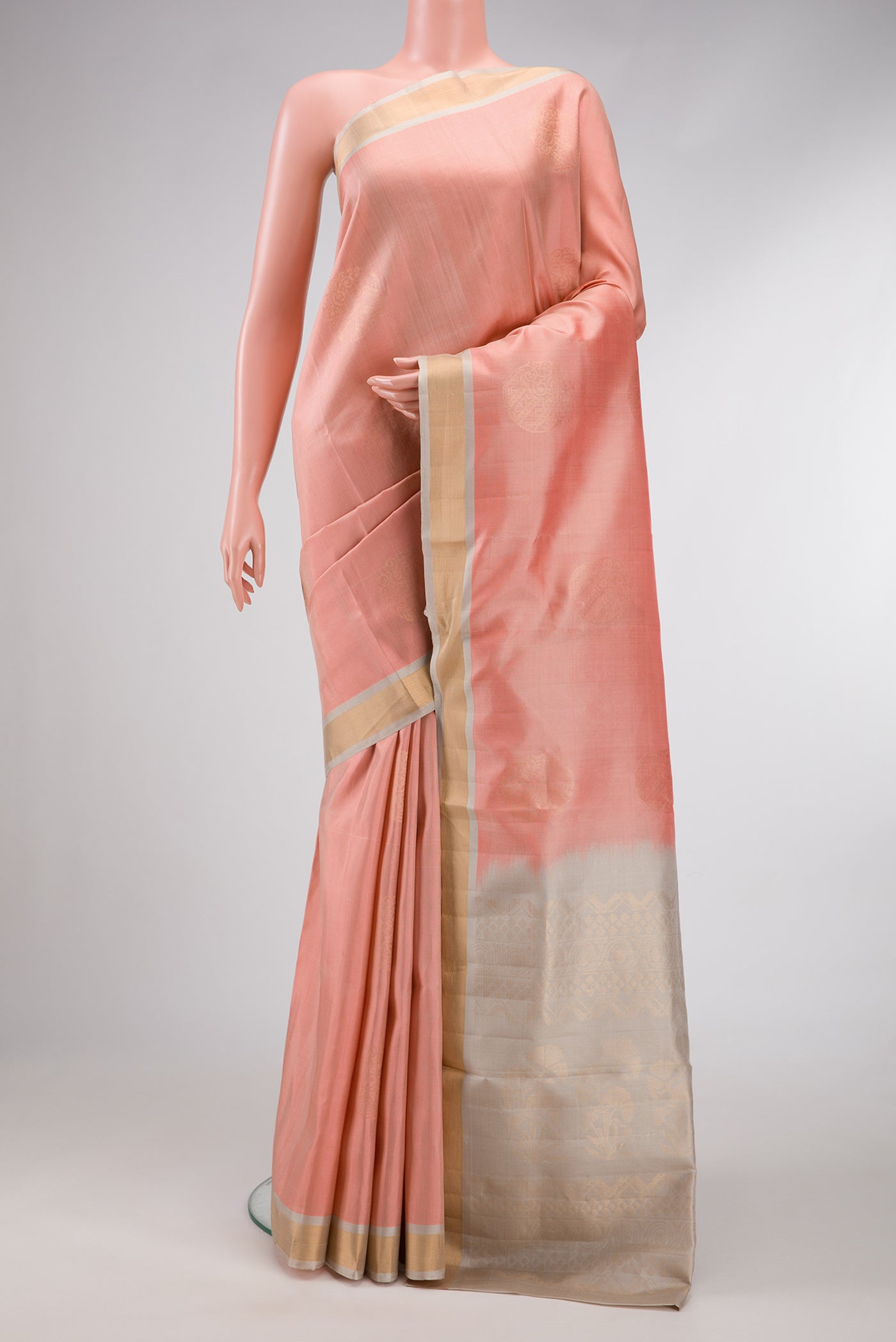 Rose Gold Dual Tone Soft Silk Saree with Zari Butta on the body and Zari Border.  displayed on a mannequin