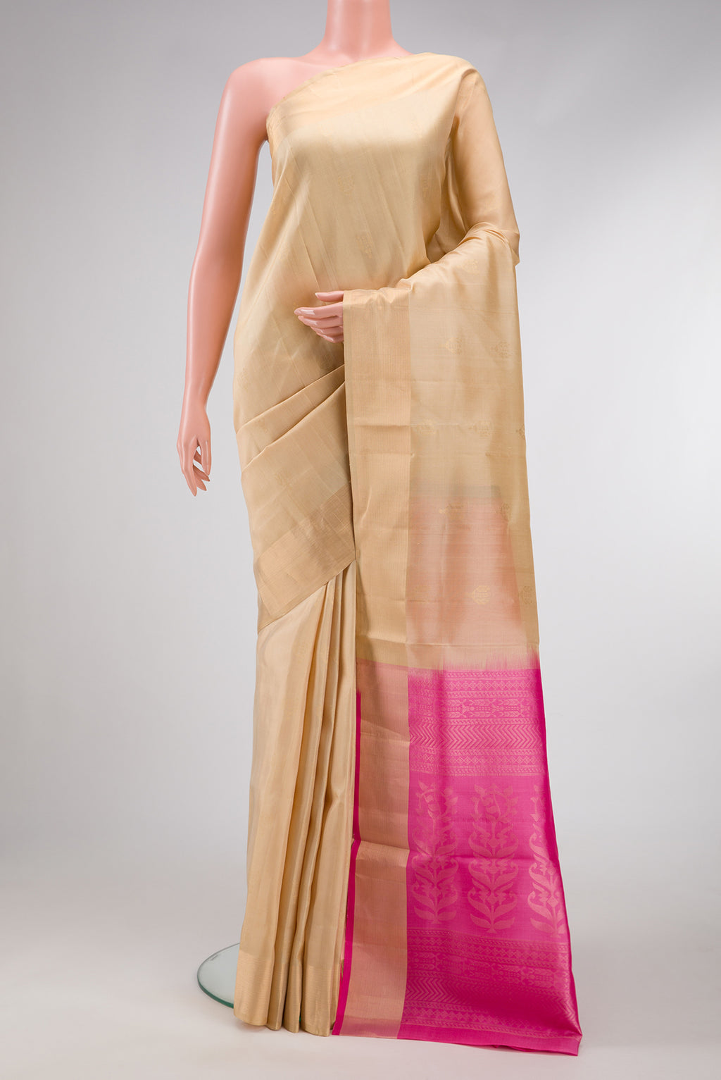 Beige Dual Tone Soft Silk Saree with Zari Butta on the body and Zari Border.  displayed on a mannequin
