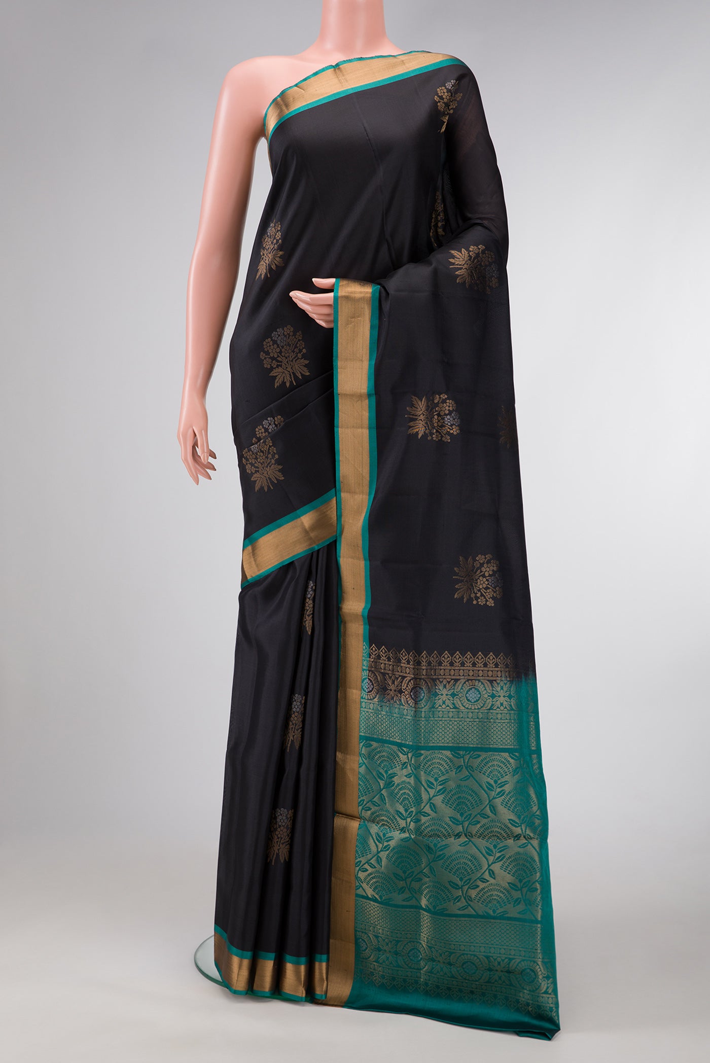 Black Dual Tone Soft Silk Saree with Zari Butta on the body and Zari Border.  displayed on a mannequin