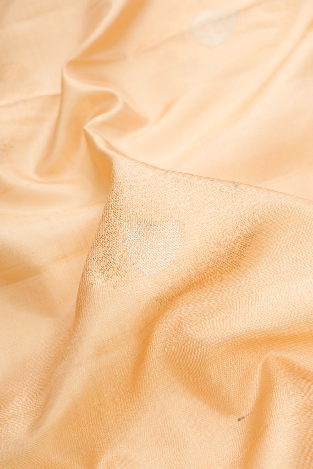Close up of Sandal Dual Tone Soft Silk Saree with Zari Butta on the body and Zari Border.  displaying folds