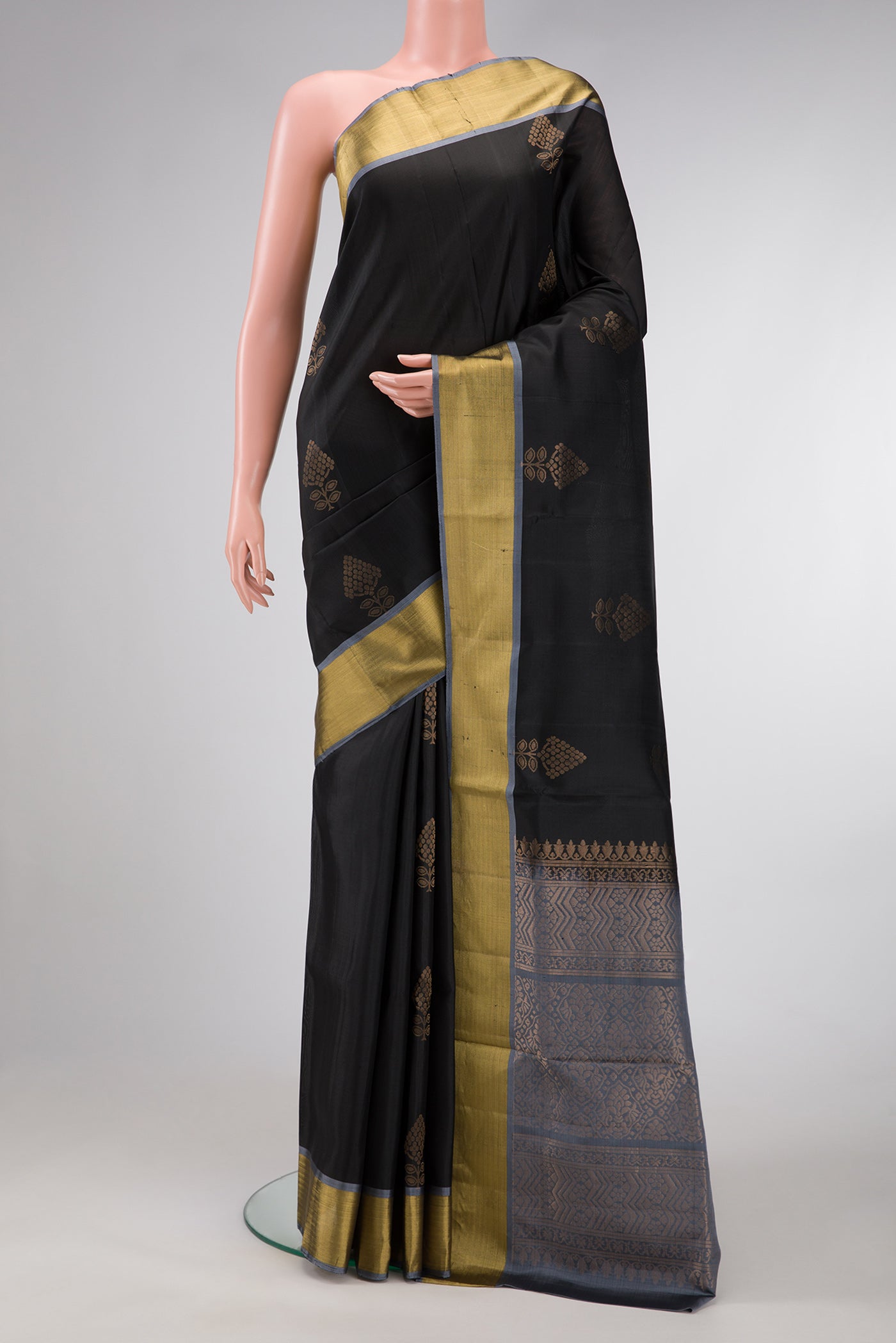 Black Dual Tone Soft Silk Saree with Zari Butta on the body and Zari Border.  displayed on a mannequin