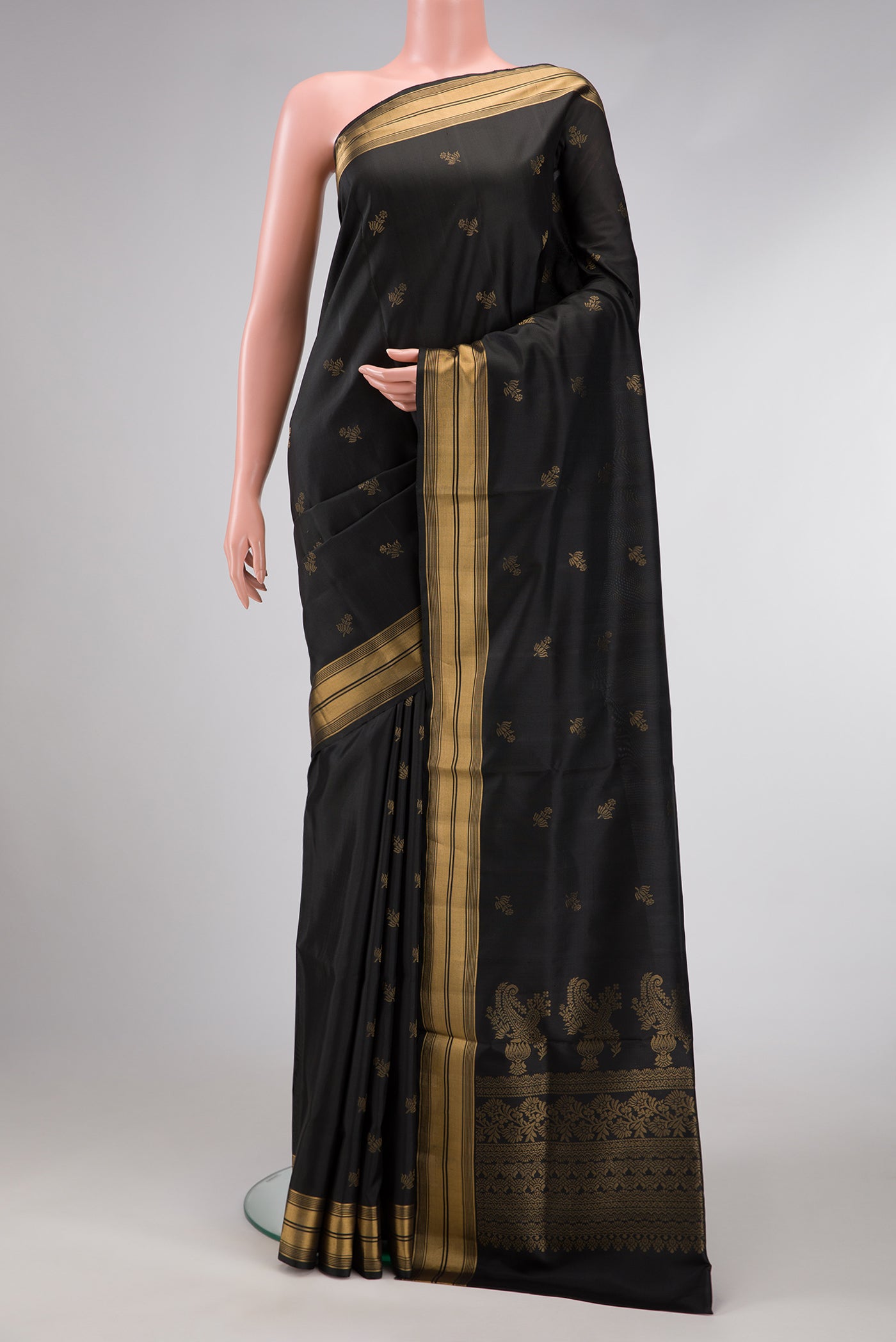 Black Dual Tone Soft Silk Saree with Zari Butta on the body and Zari Border.  displayed on a mannequin