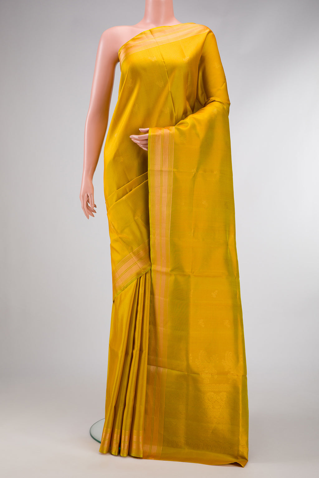 Yellow Dual Tone Soft Silk Saree with Zari Butta on the body and Zari Border.  displayed on a mannequin