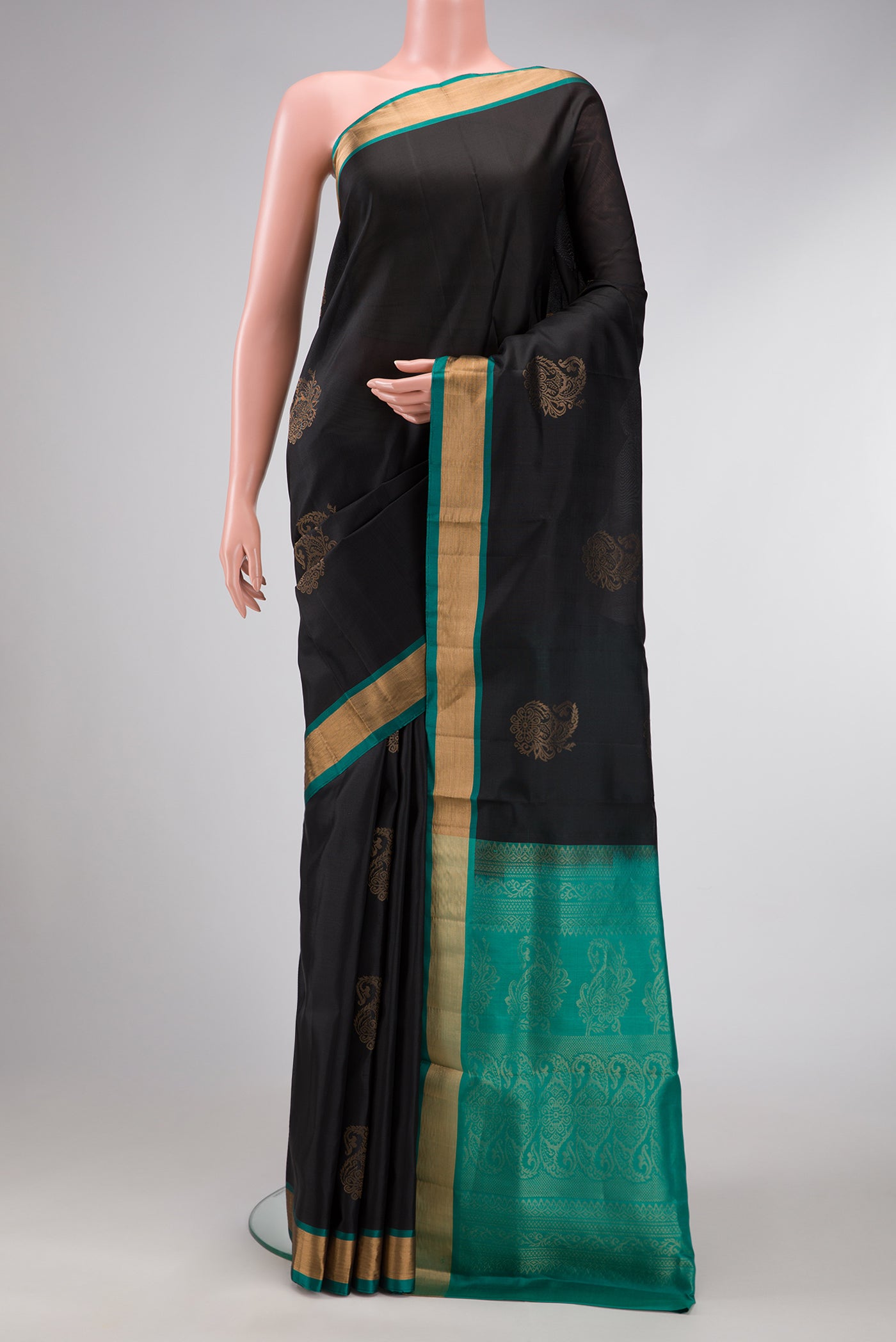 Black Dual Tone Soft Silk Saree with Zari Butta on the body and Zari Border.  displayed on a mannequin