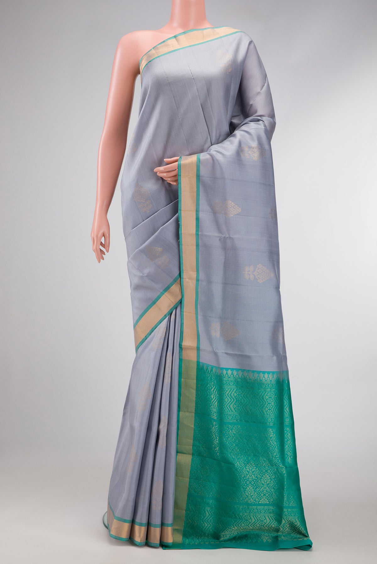 Grey Dual Tone Soft Silk Saree with Zari Butta on the body and Zari Border.  displayed on a mannequin