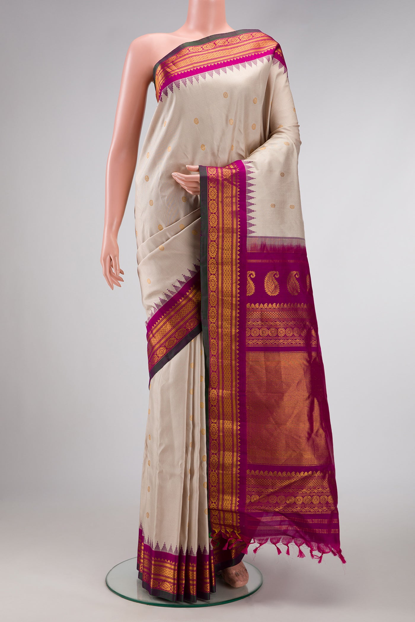 Dark Beige Dual Tone Gadwal Silk Saree with Zari Butta on the body and Zari Border.  displayed on a mannequin