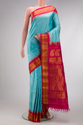 Sky Blue Dual Tone Gadwal Silk Saree with Zari Butta on the body and Zari Border.  displayed on a mannequin