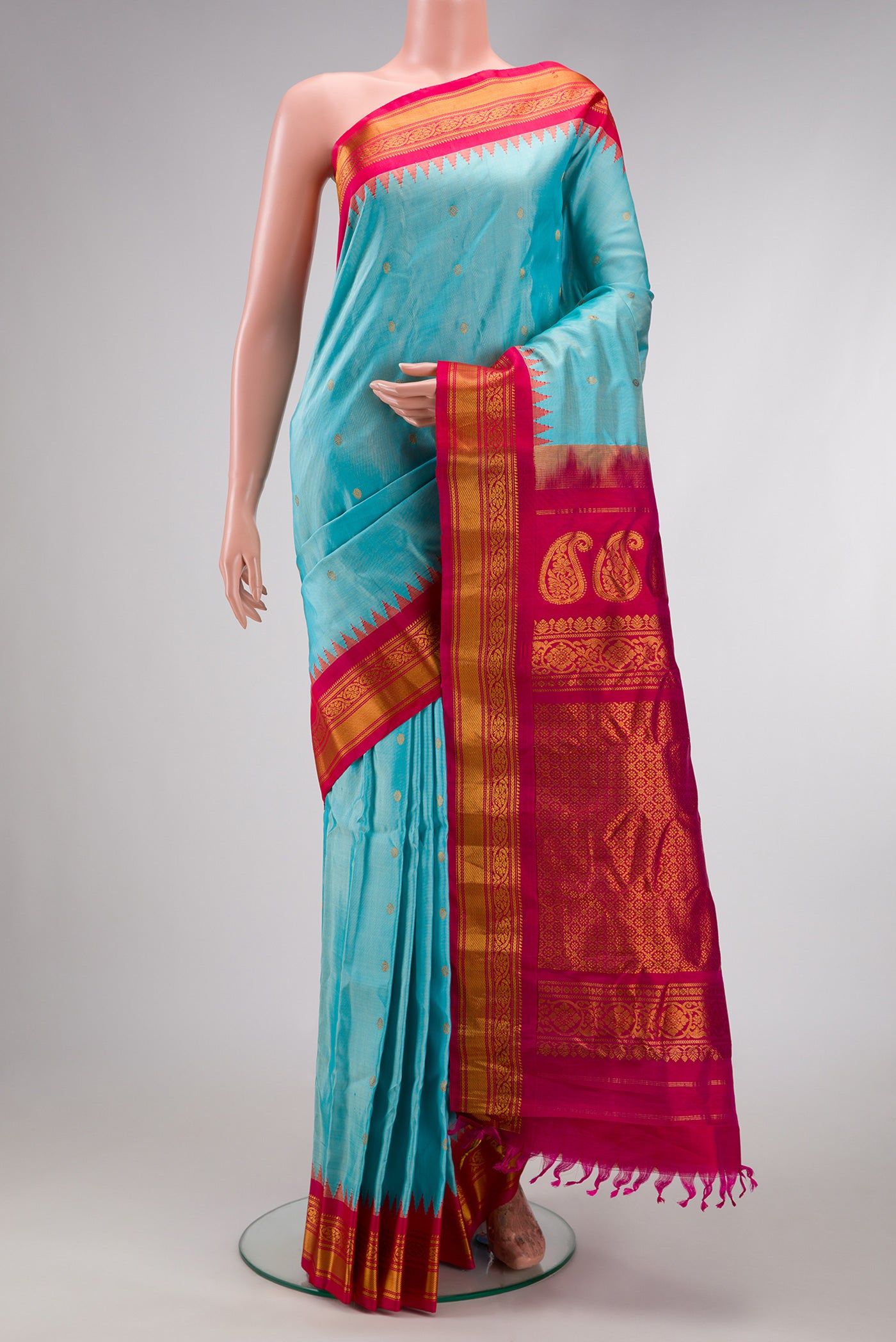 Sky Blue Dual Tone Gadwal Silk Saree with Zari Butta on the body and Zari Border.  displayed on a mannequin