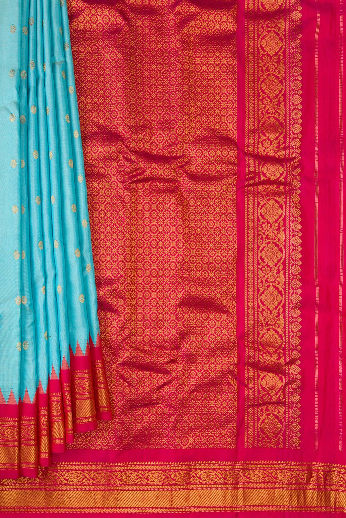 Pleats and pallu of Sky Blue Dual Tone Gadwal Silk Saree with Zari Butta on the body and Zari Border. 