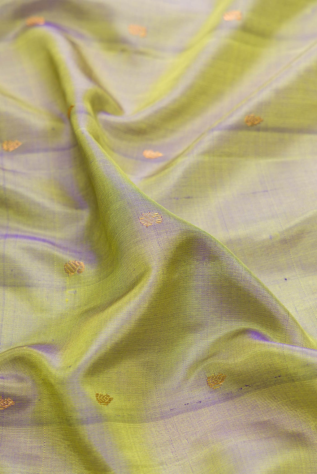 Close up of Mehandi Green Dual Tone Gadwal Silk Saree with Zari Butta on the body and Zari Border.  displaying folds