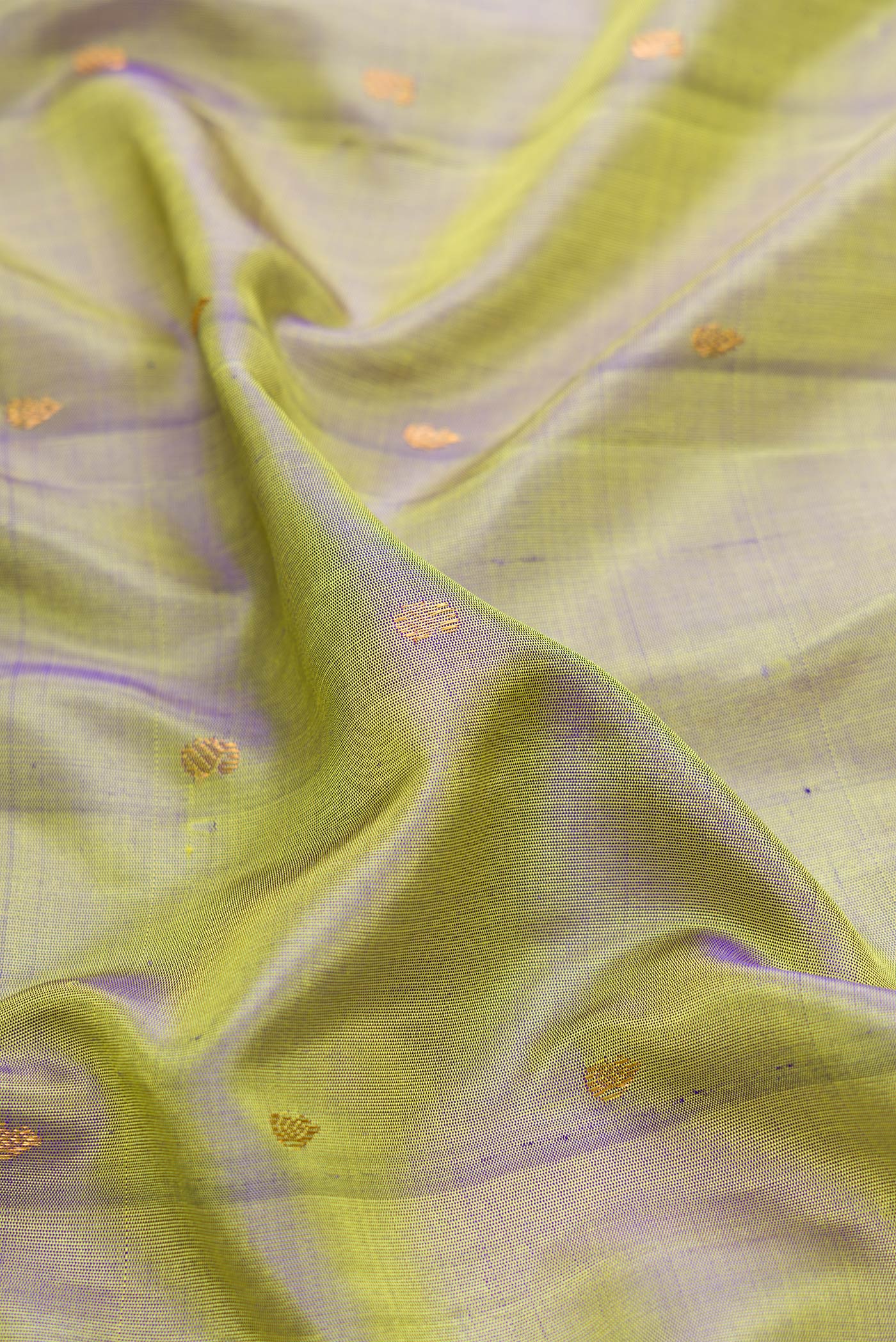 Close up of Mehandi Green Dual Tone Gadwal Silk Saree with Zari Butta on the body and Zari Border.  displaying folds