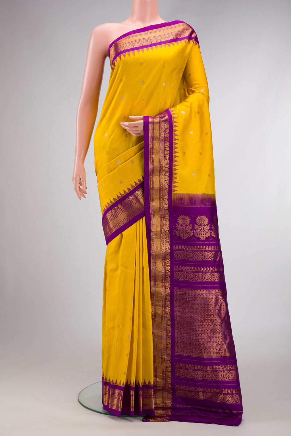 Mustard Dual Tone Gadwal Silk Saree with Zari Butta on the body and Zari Border.  displayed on a mannequin