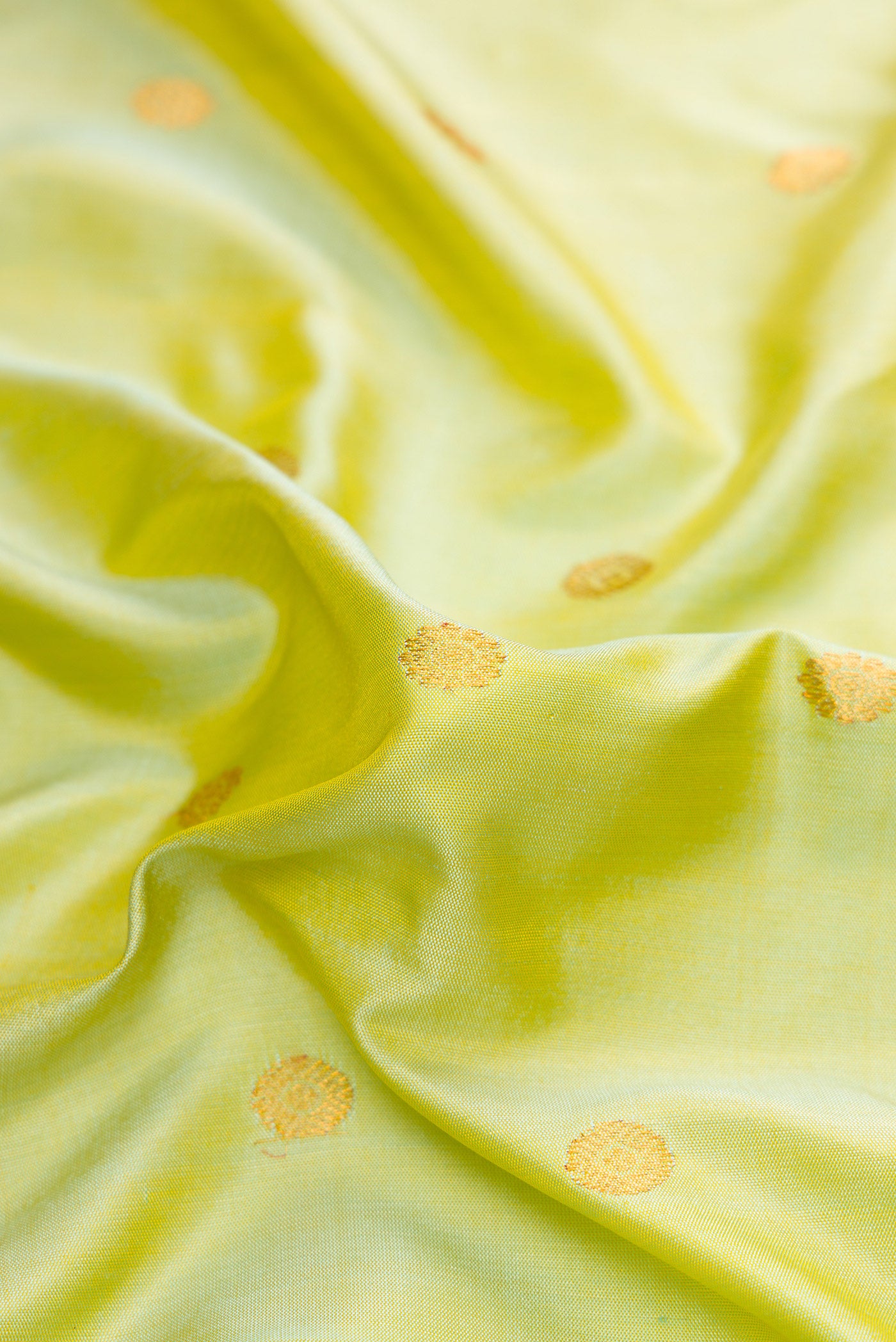 Close up of Light Green Dual Tone Gadwal Silk Saree with Zari Butta on the body and Zari Border.  displaying folds