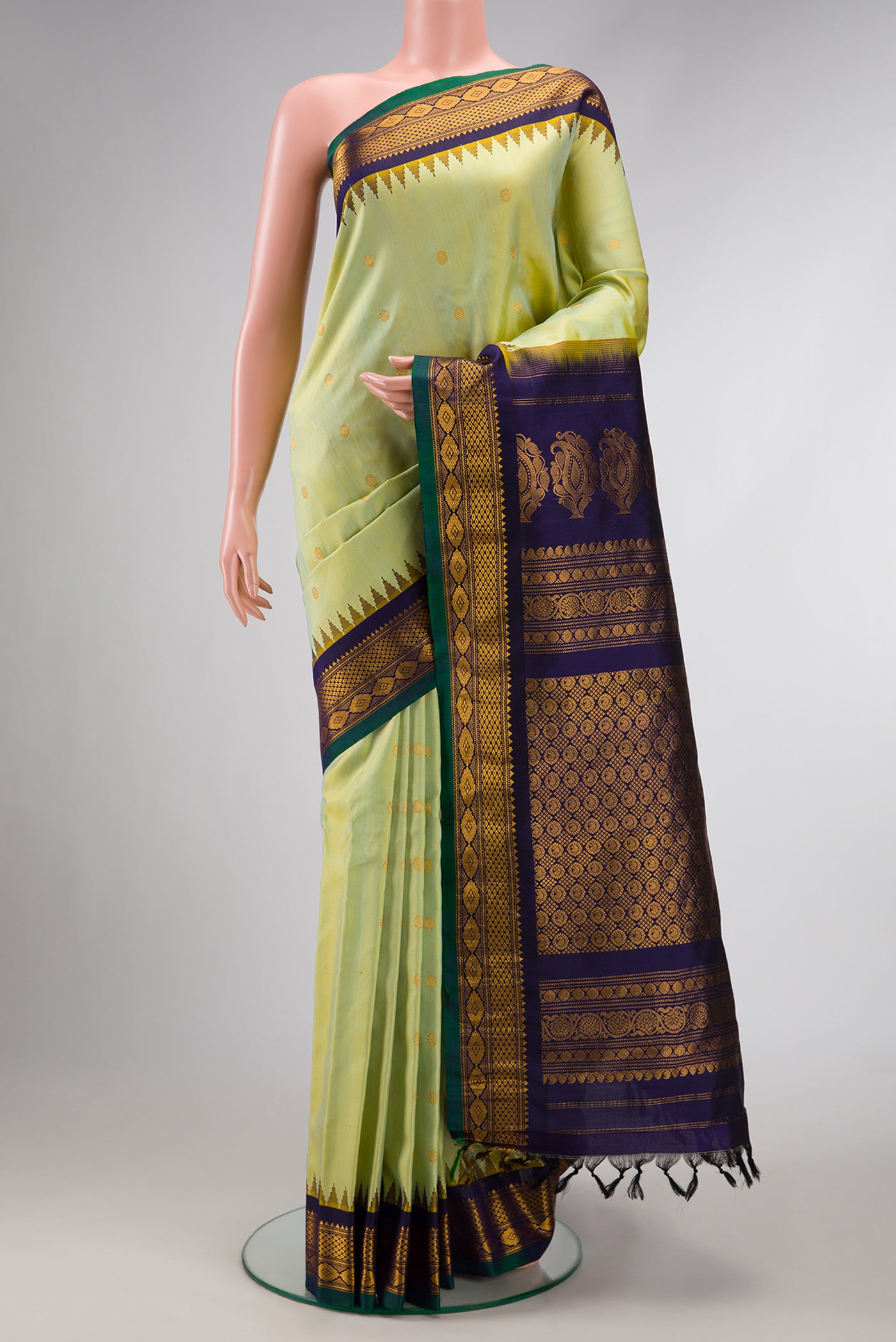 Light Green Dual Tone Gadwal Silk Saree with Zari Butta on the body and Zari Border.  displayed on a mannequin