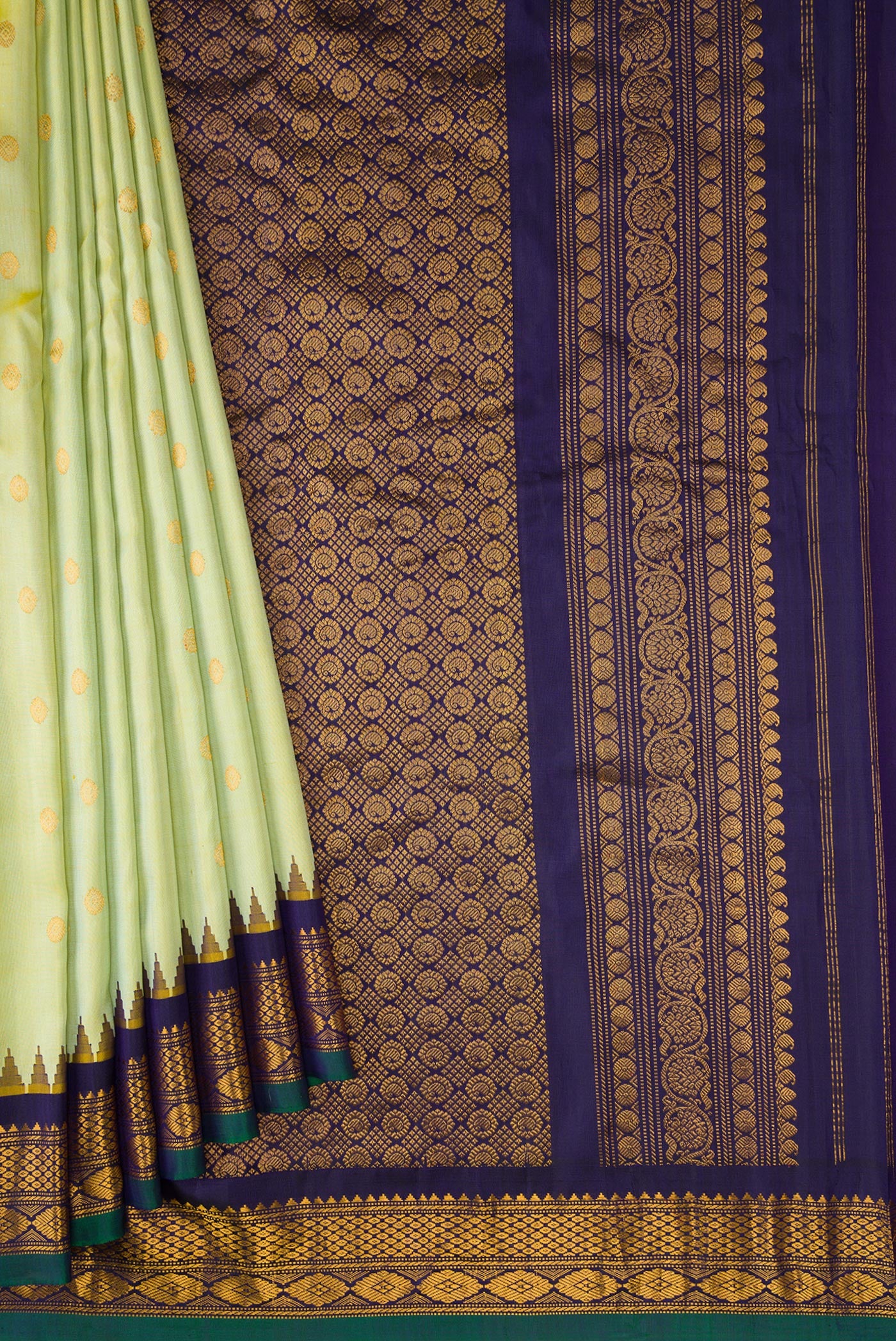 Pleats and pallu of Light Green Dual Tone Gadwal Silk Saree with Zari Butta on the body and Zari Border. 