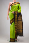 Parrot Green Dual Tone Gadwal Silk Saree with Zari Butta on the body and Zari Border.  displayed on a mannequin