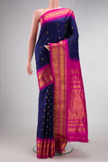 Navy Blue Dual Tone Gadwal Silk Saree with Zari Butta on the body and Zari Border.  displayed on a mannequin