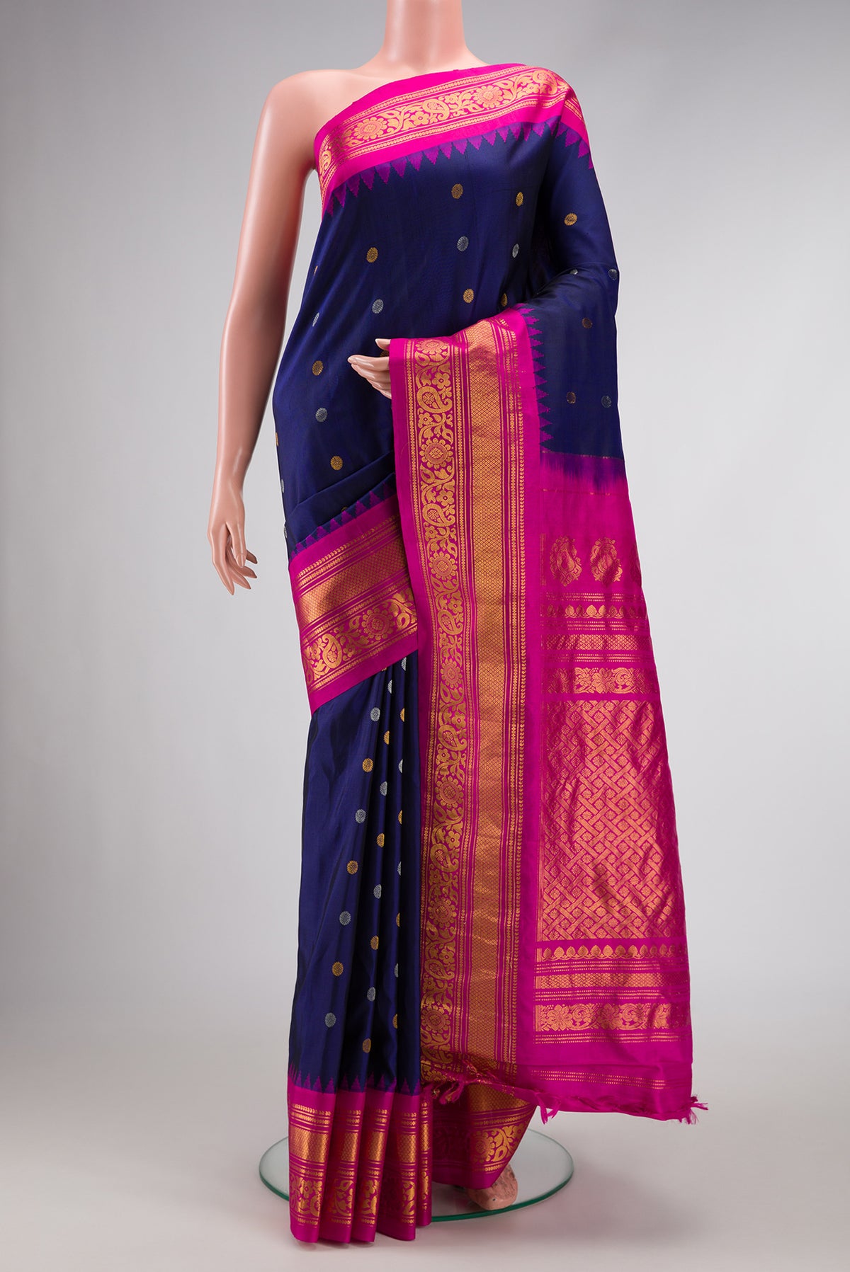 Navy Blue Dual Tone Gadwal Silk Saree with Zari Butta on the body and Zari Border.  displayed on a mannequin