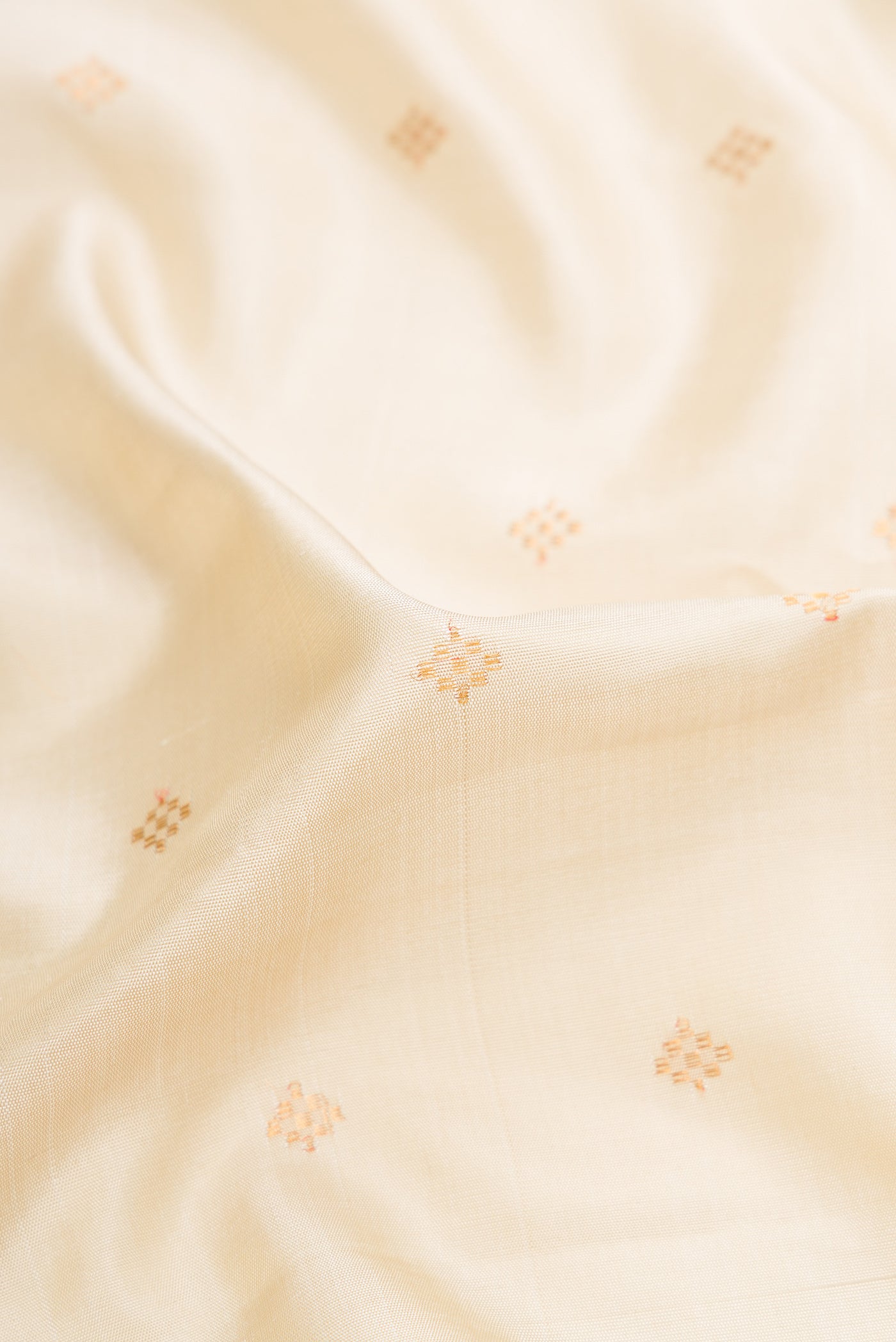 Close up of Sandal Dual Tone Gadwal Silk Saree with Zari Butta on the body and Zari Border.  displaying folds