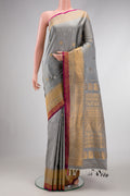 Grey Dual Tone Gadwal Silk Saree with Zari Butta on the body and Zari Border.  displayed on a mannequin