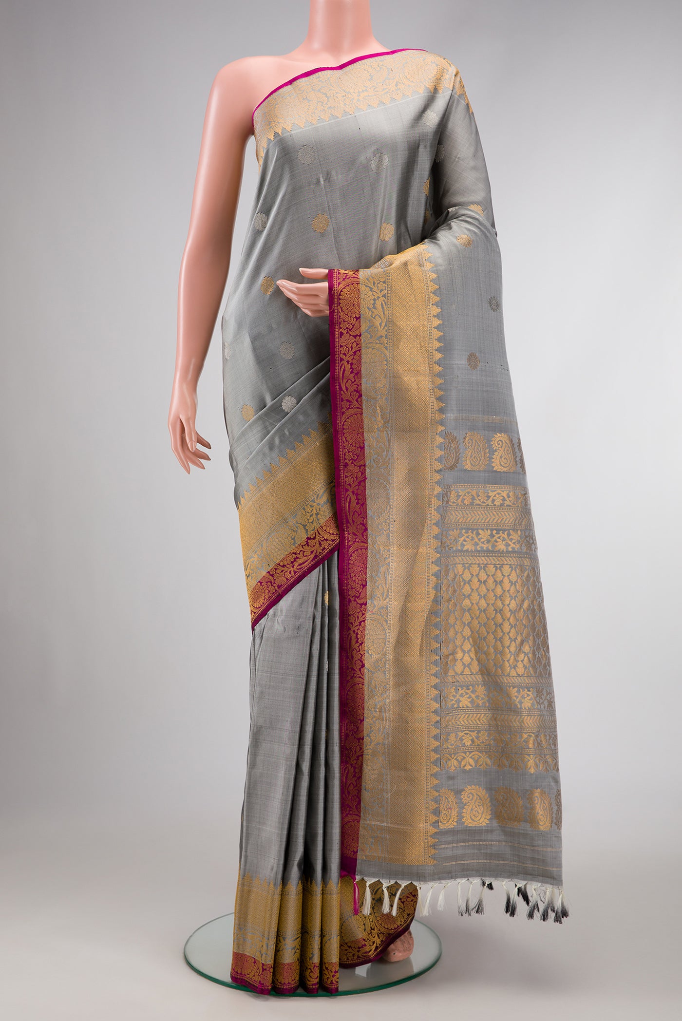 Grey Dual Tone Gadwal Silk Saree with Zari Butta on the body and Zari Border.  displayed on a mannequin