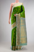 Green Dual Tone Gadwal Silk Saree with Zari Butta on the body and Zari Border.  displayed on a mannequin