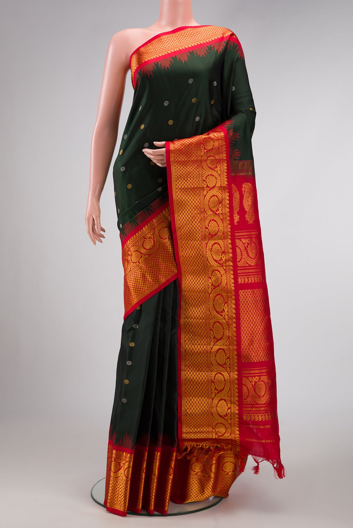 Bottle Green Dual Tone Gadwal Silk Saree with Zari Butta on the body and Zari Border.  displayed on a mannequin