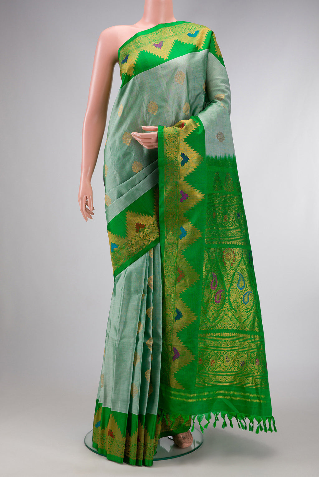 Light Green Dual Tone Gadwal Silk Saree with Zari Butta on the body and Zari Border.  displayed on a mannequin