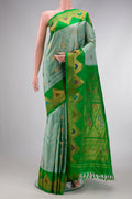 Light Green Dual Tone Gadwal Silk Saree with Zari Butta on the body and Zari Border.  displayed on a mannequin