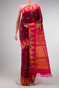 Maroon Dual Tone Gadwal Silk Saree with Zari And Thread Butta on the body and Zari Border.  displayed on a mannequin