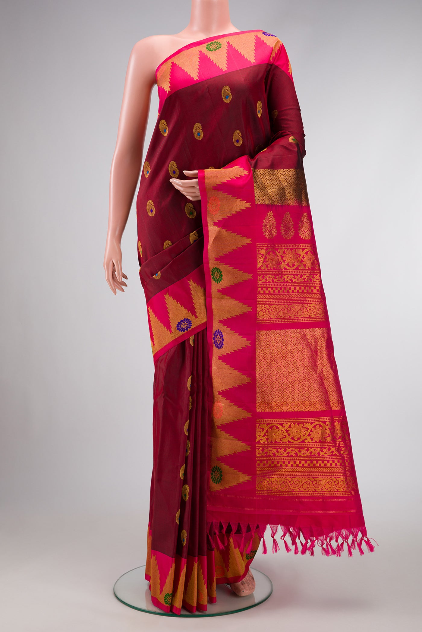 Maroon Dual Tone Gadwal Silk Saree with Zari And Thread Butta on the body and Zari Border.  displayed on a mannequin