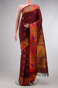Maroon Dual Tone Gadwal Silk Saree with Zari Butta on the body and Zari And Thread Border.  displayed on a mannequin