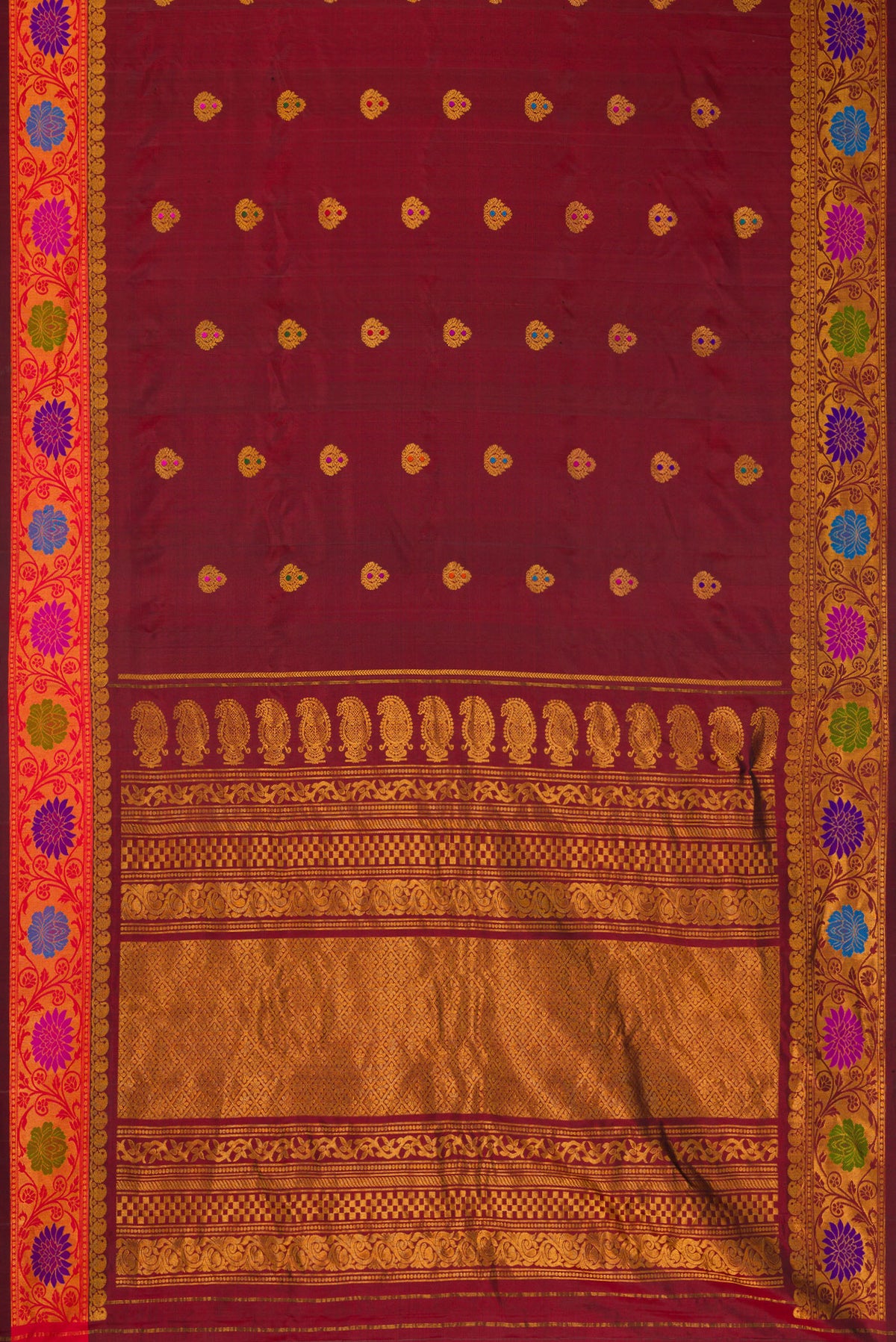 Flat view of Maroon Dual Tone Gadwal Silk Saree with Zari Butta on the body and Zari And Thread Border. 
