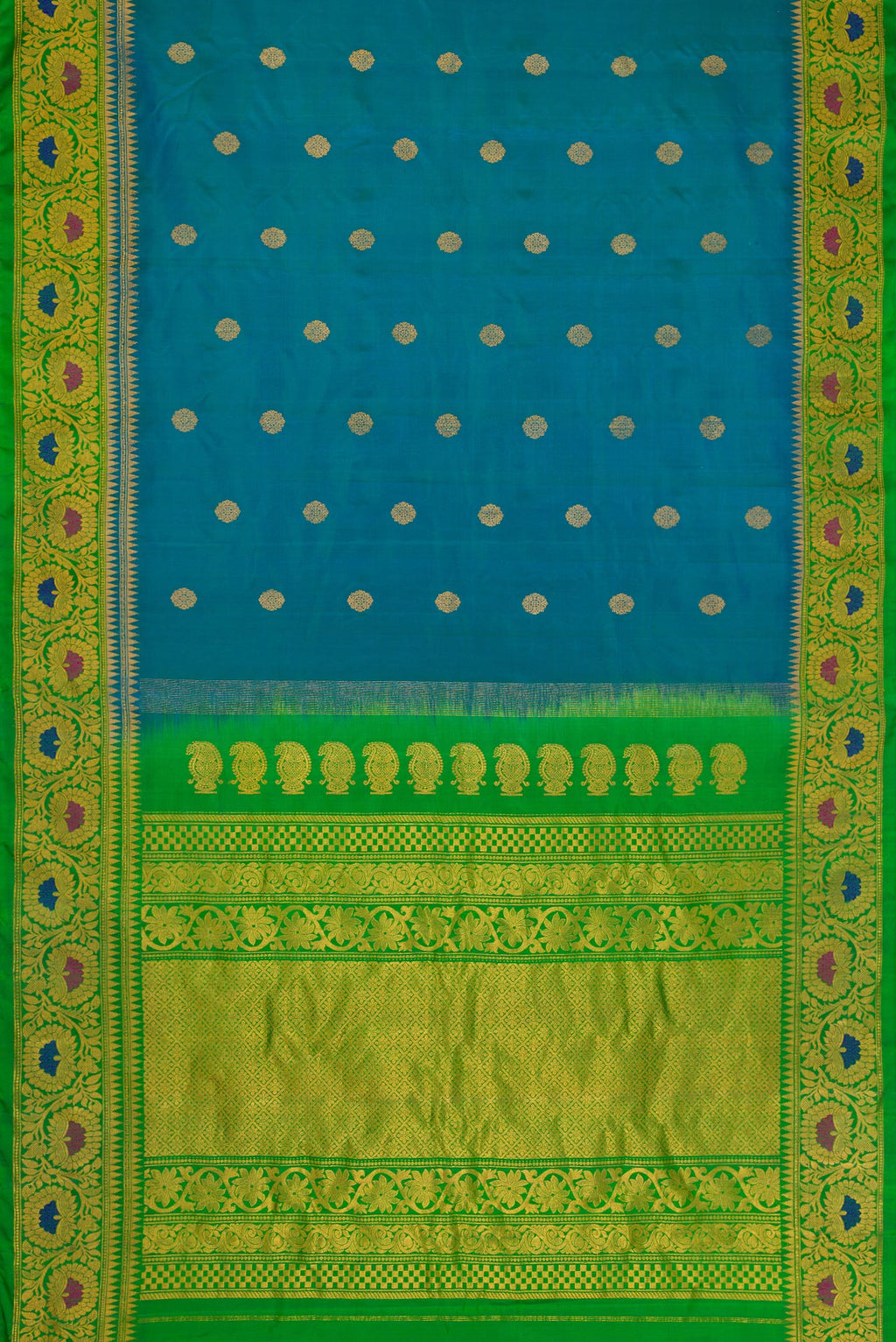Flat view of Peacock Blue Dual Tone Gadwal Silk Saree with Zari Butta on the body and Zari Border. 