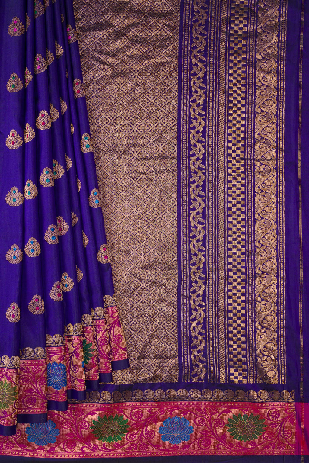 Pleats and pallu of Royal Blue Dual Tone Gadwal Silk Saree with Zari And Thread Butta on the body and Zari Border. 