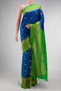 Peacock Blue Dual Tone Gadwal Silk Saree with Zari Butta on the body and Zari Border.  displayed on a mannequin