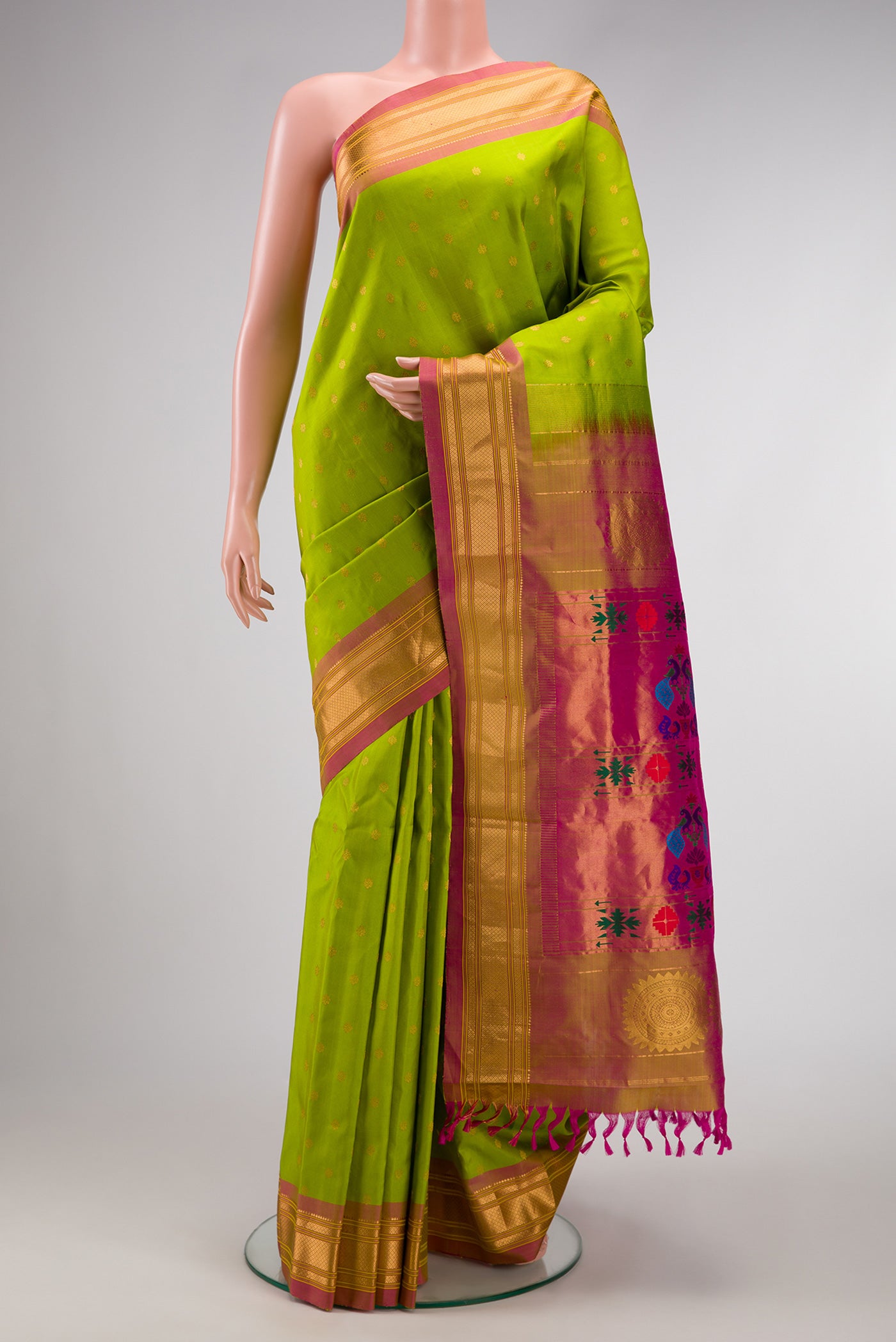 Parrot Green Dual Tone Paithani Silk Saree with Zari Butta on the body and Zari Border.  displayed on a mannequin