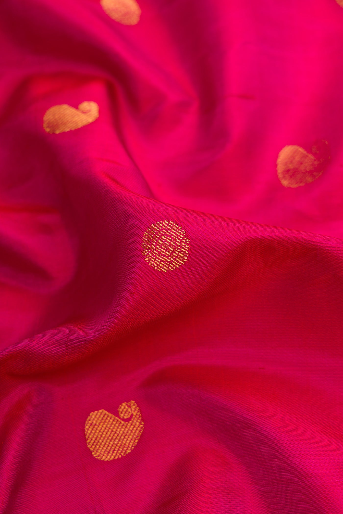 Close up of Pink Dual Tone Paithani Silk Saree with Zari Butta on the body and Zari Border.  displaying folds