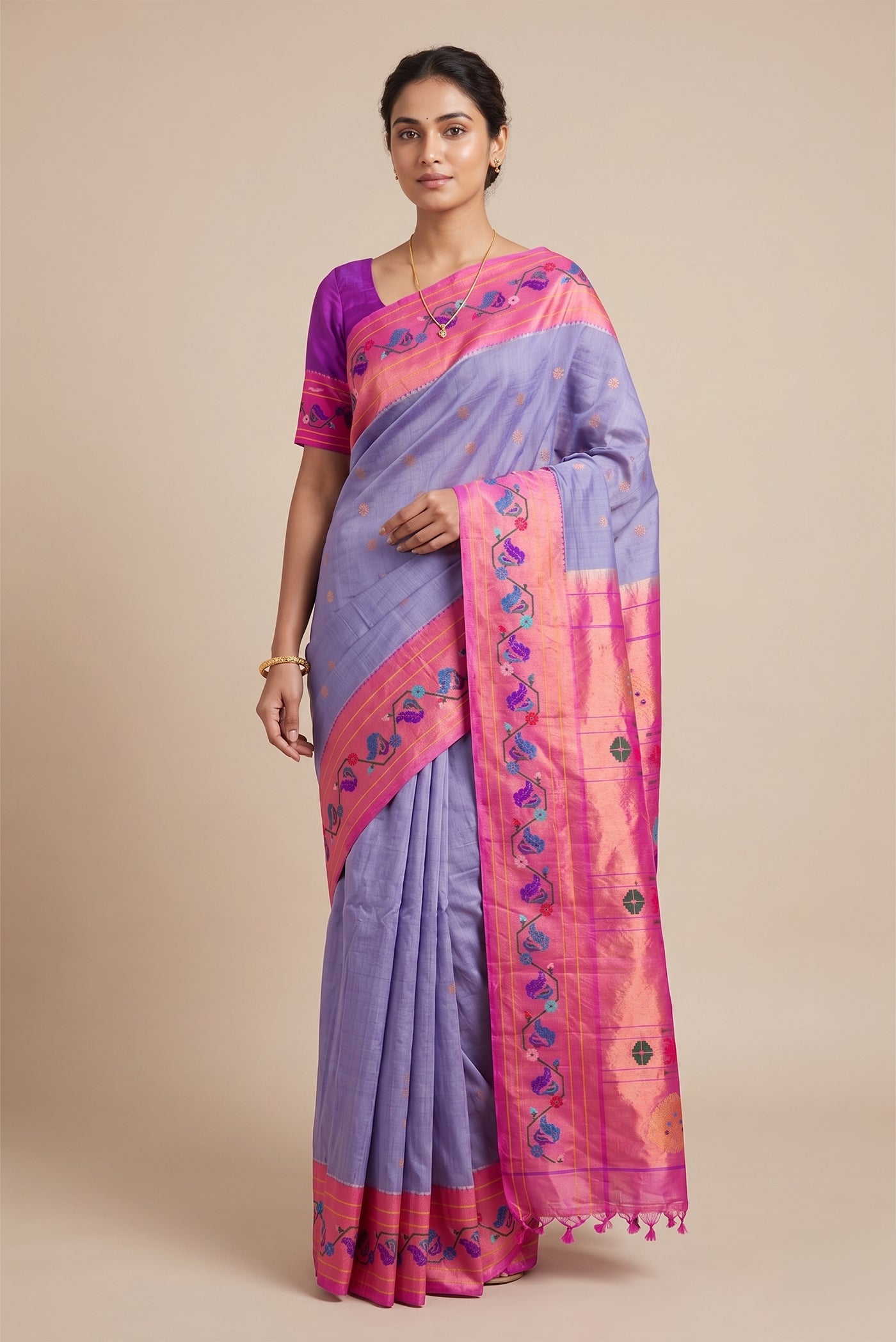 Model wearing a Lilac Gadwal Silk Saree with Zari Butta on the body and Paithani Border.