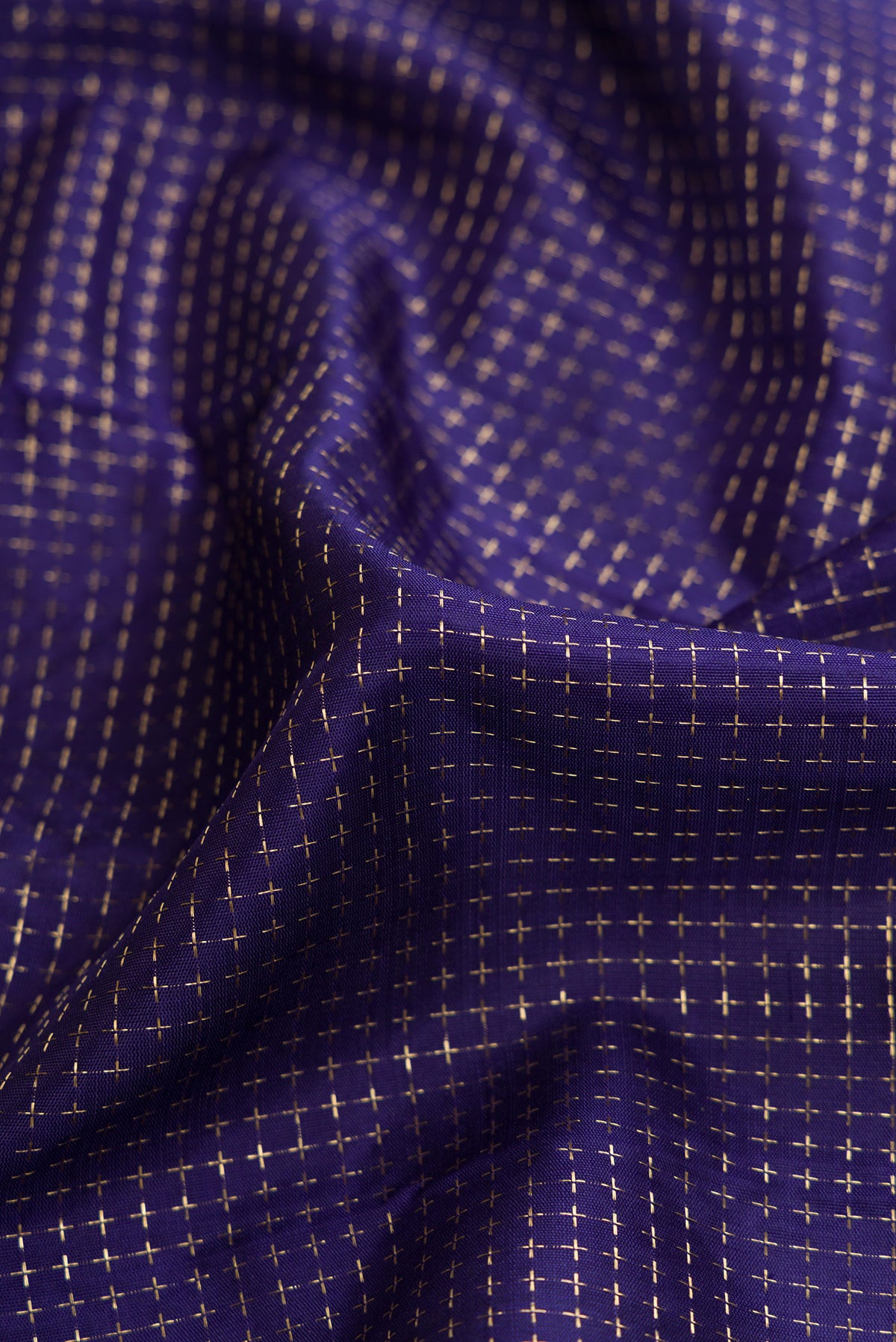 Close up of Navy Blue Dual Tone Kanjivaram Silk Saree with Checked design on the body and Zari Border.  displaying folds