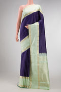 Navy Blue Dual Tone Kanjivaram Silk Saree with Checked design on the body and Zari Border.  displayed on a mannequin